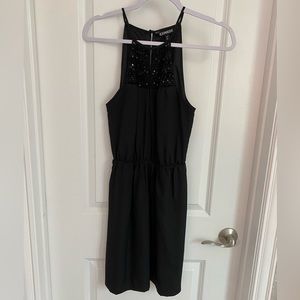 Black Express cocktail dress.Sequin beading on front top. Gathered waist.Size XS